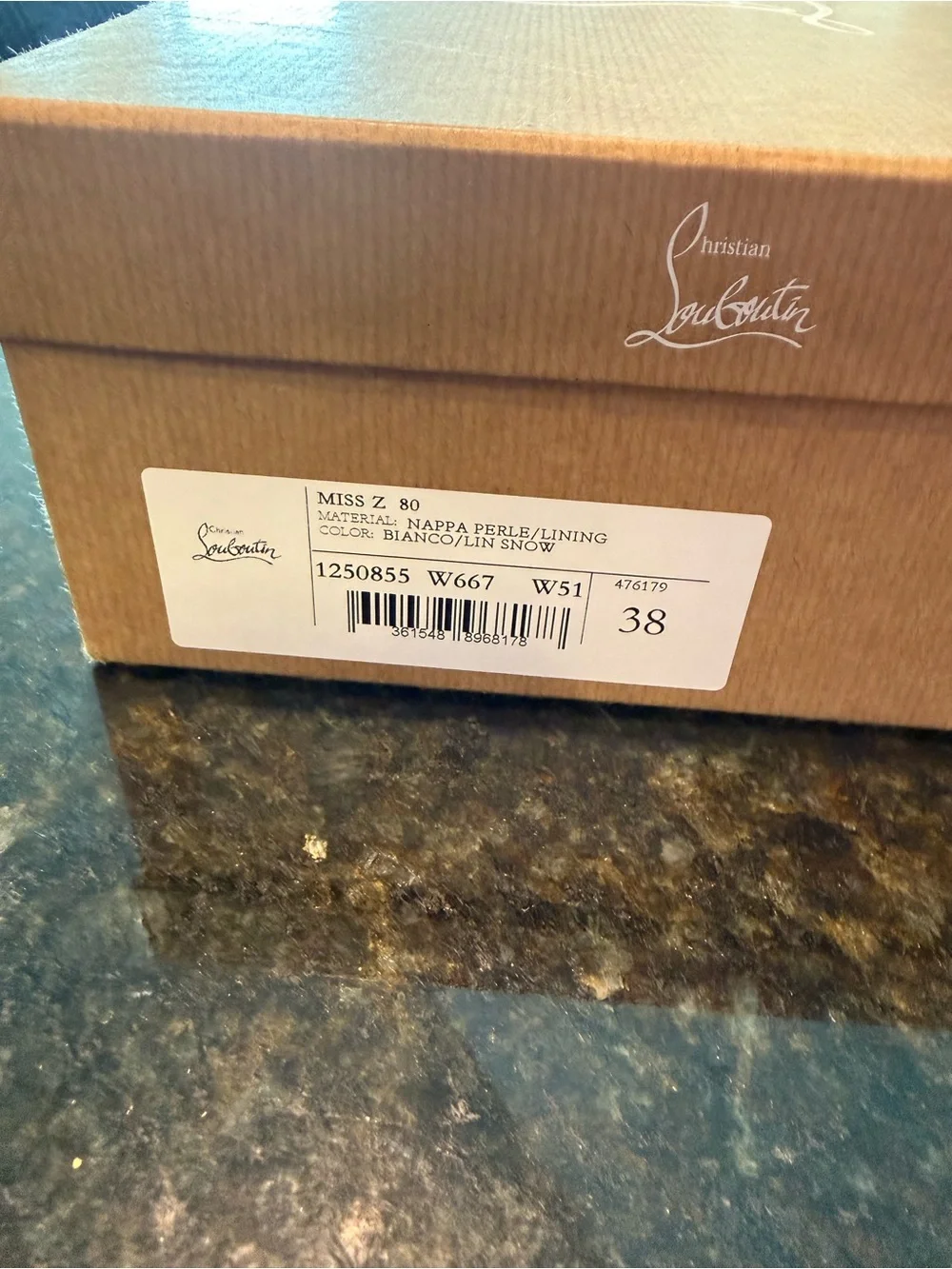 Christian Louboutin White Pointed-Toe Pump with Signature Red Sole